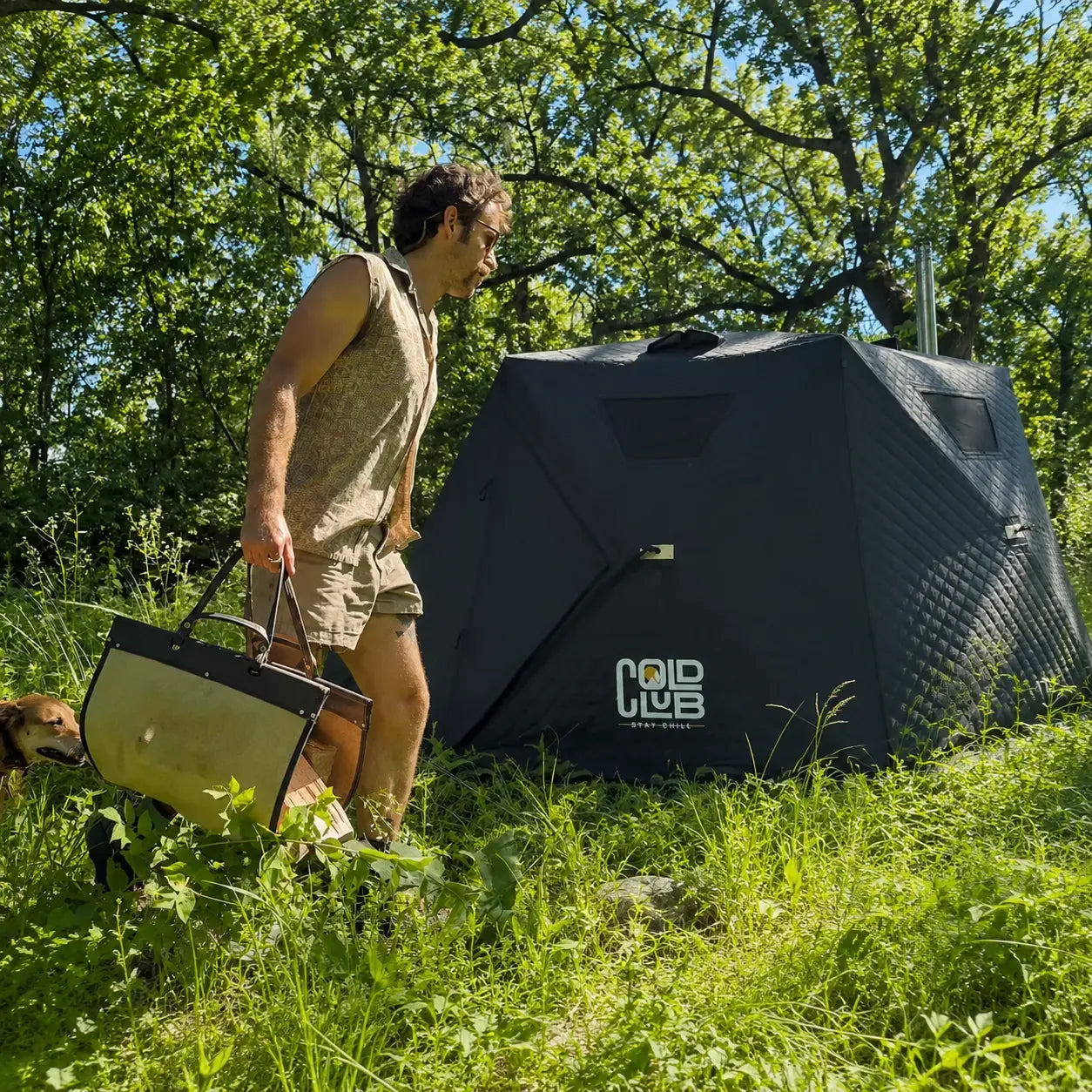 Carrying firewood beside the wood-fired sauna